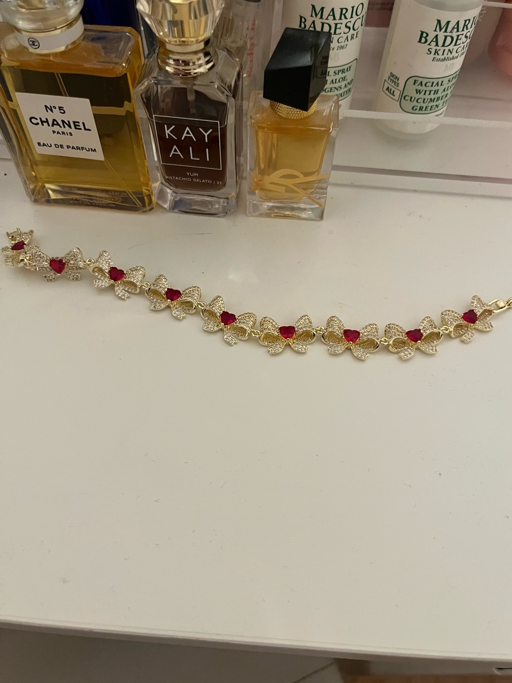 Gold Bow Bracelet with Red Heart Accents
